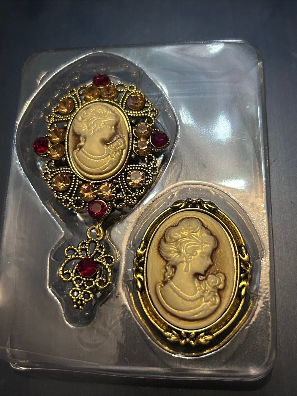 Gold-Tone Cameo Brooch Set with Ruby and Amber Accents